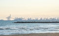 panoramic sunset view port in the Valencia harbor cranes transport From the beach Royalty Free Stock Photo