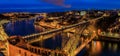 Panoramic sunset view of Porto Portugal cityscape with Dom Luis I Bridge and Douro River Royalty Free Stock Photo