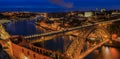 Panoramic sunset view of Porto Portugal cityscape with Dom Luis I Bridge and Douro River Royalty Free Stock Photo