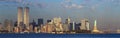 Panoramic sunset view of World Trade Towers, Statue of Liberty, Brooklyn Bridge, and Manhattan, NY skyline