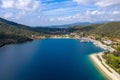 Panoramic top view on Mediterranean sea blue water with white sandy beach road along green hills coastline, yachts and boats pier Royalty Free Stock Photo