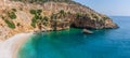 Panoramic tropical sea, beach and cave landscape from Kaputas, Antalya, Turkey. Holiday, travel and tourism concept Royalty Free Stock Photo