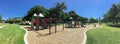 Panoramic urban playground surrounded by large trees and landmarks background in downtown Dallas, Texas, USA Royalty Free Stock Photo