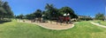 Panoramic urban playground surrounded by large trees and landmarks background in downtown Dallas, Texas, USA Royalty Free Stock Photo