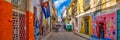 Urban scene with a cuban flag on a colorful street in Havana