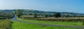 Panoramic view across English farmland on sunny autumn day