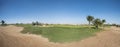 Panoramic view across golf course in landscaped tropical resort