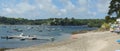 Panoramic view across the picturesque Helford River to Helford River Sailing Club in Cornwall, UK