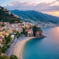 Panoramic view, aerial skyline of small haven of Amalfi village with tiny beach and colorful houses, located on rock,