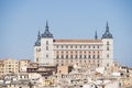 panoramic view of the Alcazar of Toledo and part of the surrounding houses one sunny and torrid afternoon