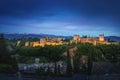 Panoramic view of Alhambra at sunset with Sierra Nevada Mountains on background - Granada, Andalusia, Spain Royalty Free Stock Photo