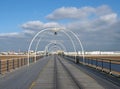 The pier in southport merseyside with the beach at low tide on a summer day with buildings of the town and Royalty Free Stock Photo