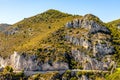 Panoramic view of Alpes rocky coastline with Avenue Bella Vista route at Mediterranean Sea seen from town of Eze in France