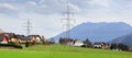 Panoramic view of the alpine village Unterburg with the power transmission line tower in the foreground. Styria, Austria, Europe. Royalty Free Stock Photo