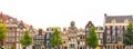 Panoramic view of Amsterdam houses - background isolated on white. Various traditional houses in the historic center of Amsterdam