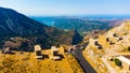 a panoramic view of the ancient centuries-old mills against the backdrop of mountains and olive groves of Crete filmed Royalty Free Stock Photo