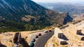 a panoramic view of the ancient centuries-old mills against the backdrop of mountains and olive groves of Crete filmed Royalty Free Stock Photo