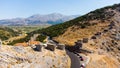 a panoramic view of the ancient centuries-old mills against the backdrop of mountains and olive groves of Crete filmed Royalty Free Stock Photo