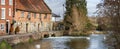 Panoramic view of the ancient Old Mill at Harnham alongside the River Avon in Harnham, Salisbury, Wiltshire, UK Royalty Free Stock Photo