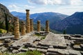 Panoramic view of ancient ruin world heritage site at temple of Apollo with green olive groves valley, Parnassus mountain Royalty Free Stock Photo