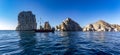 Panoramic view of the arch of Cabo San Lucas and a pirate ship plying the Gulf of California that joins the Sea of Cortez.