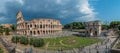 Panoramic view of The Arch of Constantine and The Coliseum seen from theeastern end of the Roman Forum in Rome, Italy