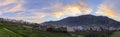 Panoramic view of Archanes town at sunset time. Sun has just went down behind Juktas mountain Royalty Free Stock Photo