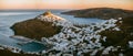Panoramic view of Astypalaia Chora with the sun setting and a sm