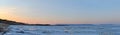 Panoramic view of the bank of the Volga River, covered with ice and the Zhiguli Mountains at sunrise. Royalty Free Stock Photo