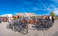 Panoramic view of a beach bar and cafeteria at Elbe river bank with many bicycles in front outdoor in Magdeburg downtown, Eastern