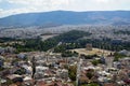 Panoramic view of beautiful Athens city from Acropolis seeing ancient ruin, building architecture, urban street, trees, mountain