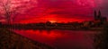 Panoramic view of beautiful bloody sunset in front of Cathedral of Magdeburg, downtown and river Elbe, Magdeburg, Germany, Autumn