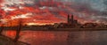 Panoramic view of beautiful bloody sunset in front of Cathedral of Magdeburg, downtown and river Elbe, Magdeburg, Germany, Winter