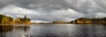 Panoramic view of beautiful forest lake in Finland. Autumn landscape, trees in fall colors Royalty Free Stock Photo