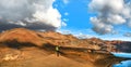 Panoramic view of beautiful geothermal landscape with woman standing on mountain top near Askja crater lake, South Iceland Royalty Free Stock Photo