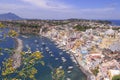 Panoramic view of beautiful Procida in sunny summer day. Colorful houses, cafes and restaurants, fishing boats and yachts in Marin Royalty Free Stock Photo