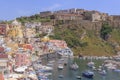 Panoramic view of beautiful Procida in sunny summer day. Colorful houses, cafes and restaurants, fishing boats and yachts in Marin Royalty Free Stock Photo