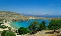 Panoramic view of the beautiful secluded bay and beach at Lindos town on the island of Rhodes, Greece Royalty Free Stock Photo