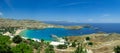 Panoramic view of the beautiful secluded bay and beach at Lindos town on the island of Rhodes, Greece Royalty Free Stock Photo