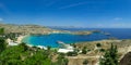 Panoramic view of the beautiful secluded bay and beach at Lindos town on the island of Rhodes, Greece Royalty Free Stock Photo