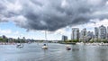 Beautiful Vancouver downtown. Yacht in False Creek and stormy clouds, British Columbia Canada