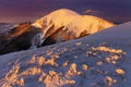 Panoramic view of beautiful winter wonderland mountain scenery in evening light at sunset. Mountains above the clouds. Royalty Free Stock Photo