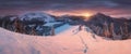 Panoramic view of beautiful winter wonderland mountain scenery in evening light at sunset. Mountains above the clouds. Christmas Royalty Free Stock Photo