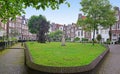 Panoramic View of Begijnhof with large green area with trees in the middle at capital city Amsterdam