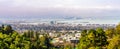 Panoramic view of Berkeley; San Francisco Bay shoreline with Port of Oakland, Yerba Buena Island, Treasure Island, the Bay bridge Royalty Free Stock Photo