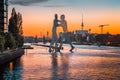 Berlin skyline with Molecule Man sculpture in Spree river at sunset, Germany Royalty Free Stock Photo