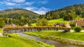 Beskidy Mountains surrounding Szczyrk mountain resort with bridge over Zylica creek in Beskidy Mountains in Poland Royalty Free Stock Photo