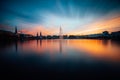 Panoramic view of Binnenalster, Inner Alster Lake in golden and blue evening light at sunset, Hamburg, Germany. Blue Royalty Free Stock Photo