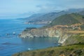 Panoramic view of Bixby Creek Bridge along rugged coastline of Big Sur with Santa Lucia Mountains along famous Highway 1, Monterey Royalty Free Stock Photo