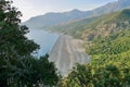 Panoramic view of black pebble beach in Nonza, Corsica, France. Royalty Free Stock Photo